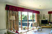 Patterned curtains with matching gathered valance.